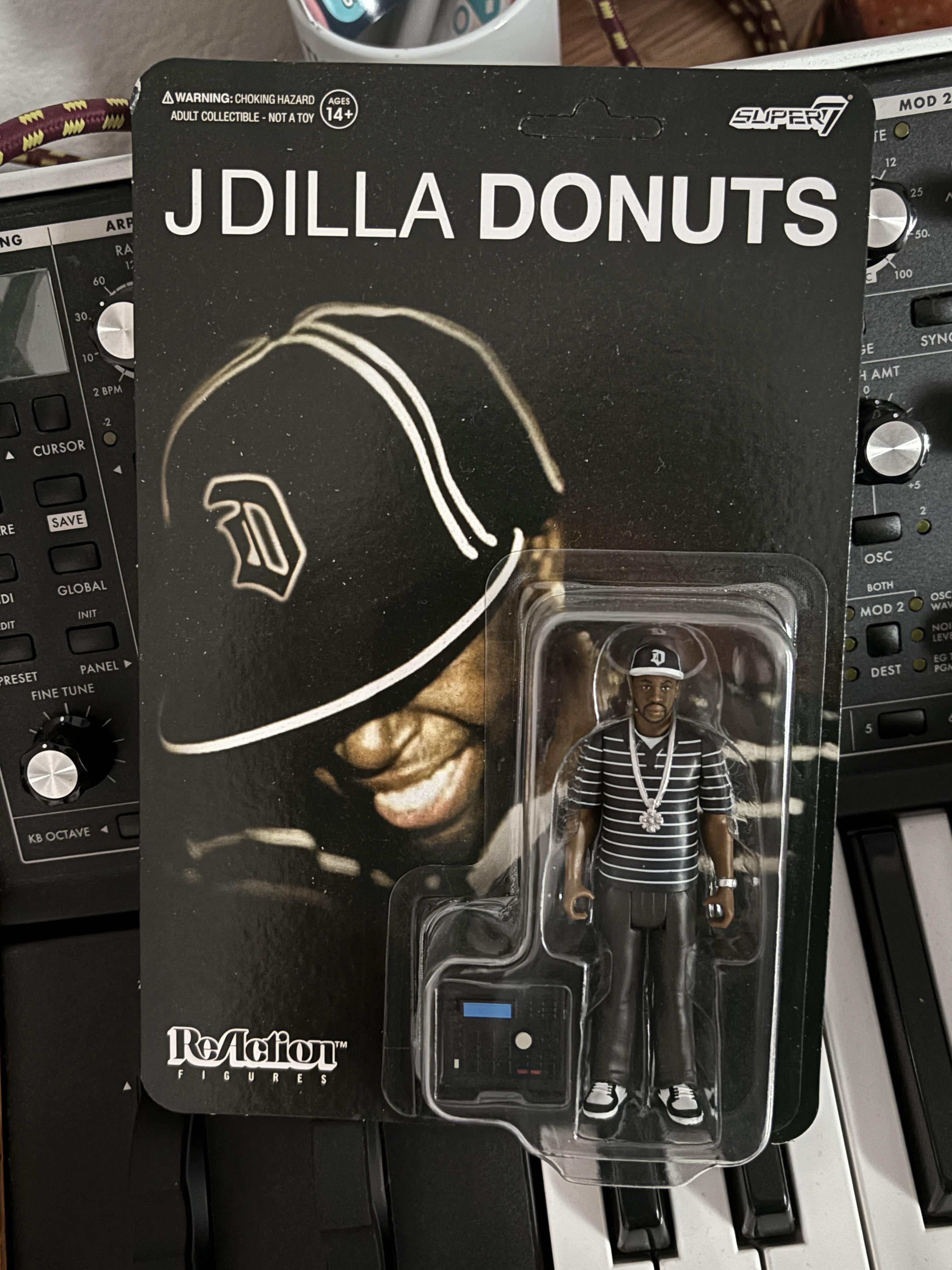 Super7 ReAction J Dilla Donuts Smile figurină
