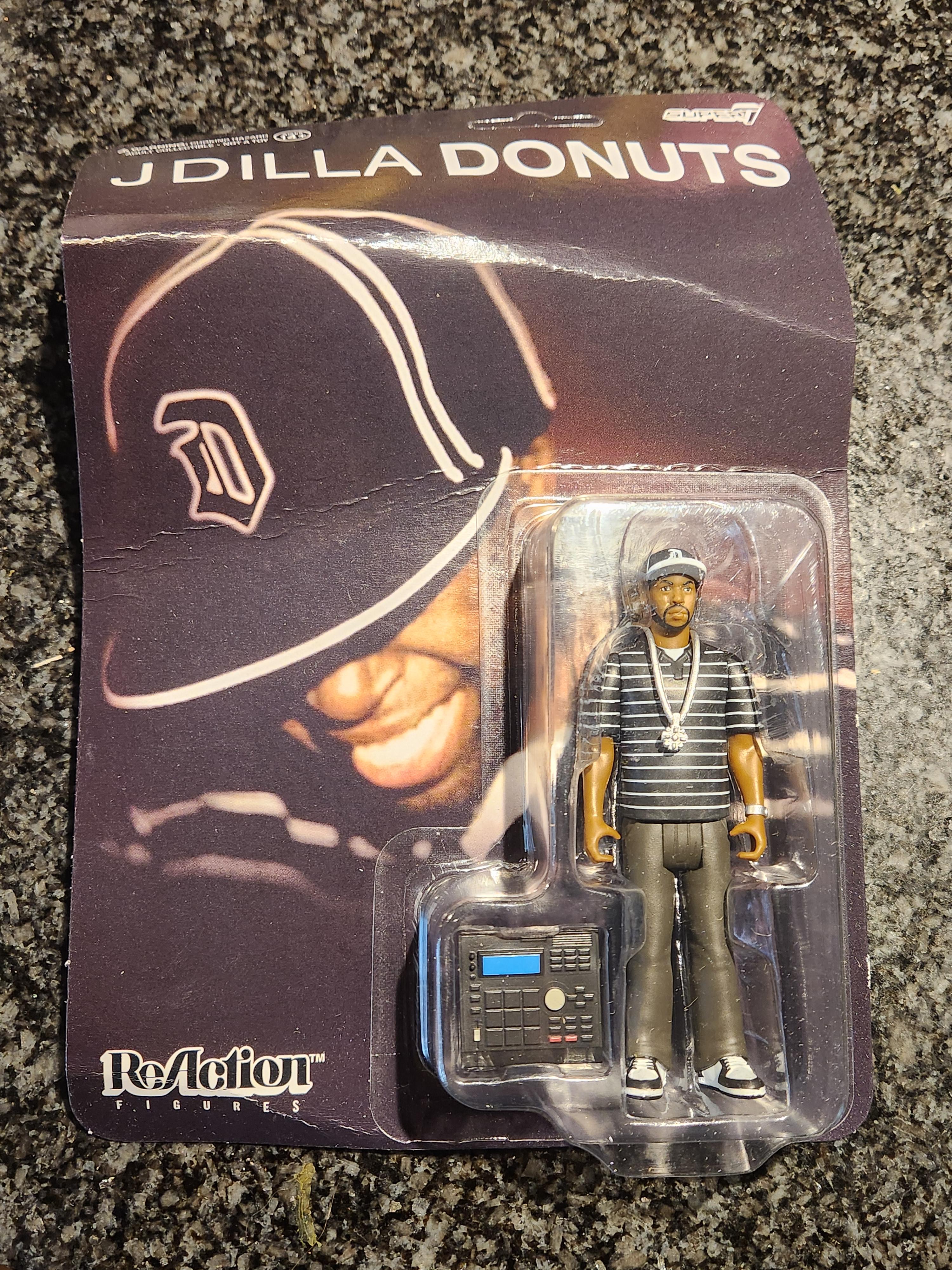 Super7 ReAction J Dilla Donuts Smile figurină
